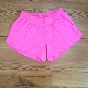 Lululemon Hotty Hot shirts size 8. Highlighter pink. Low rise